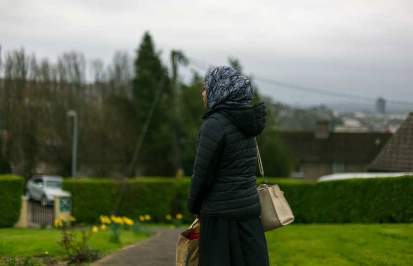 Lone girl standing in a driveway