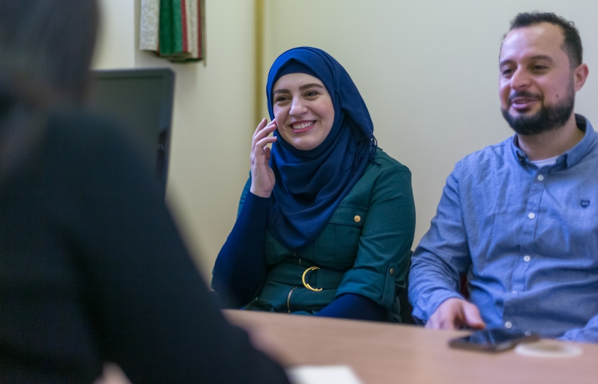 Couple sitting at a desk